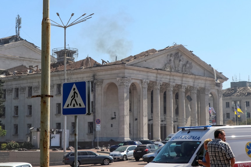 Picture of a building with smoke rising from it 