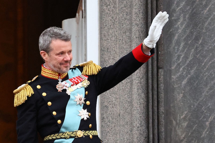 King Frederik waves and cries as he is proclaimed King.