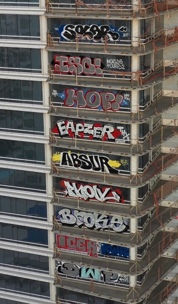 27-storeys of the two buildings were seen with graffiti tags all over them