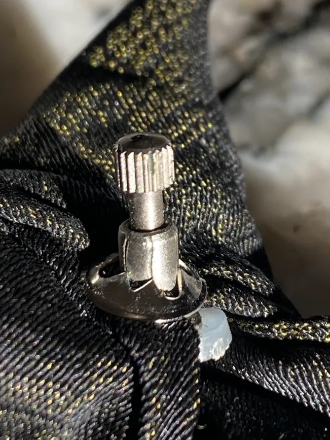 A metal clasp built into the knot of Cooper's tie (detailed in a replica above) may still hold Cooper's DNA