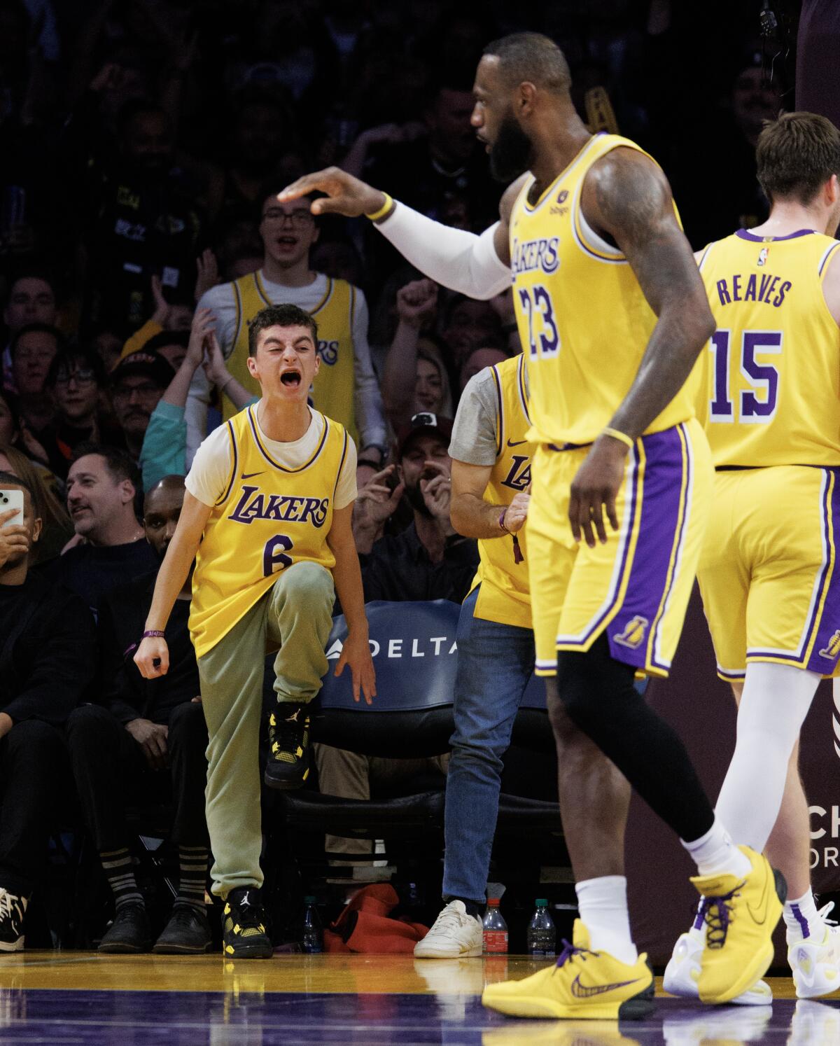 A young Lakers fan reacts after Lakers star LeBron James scores against the Oklahoma Thunder.