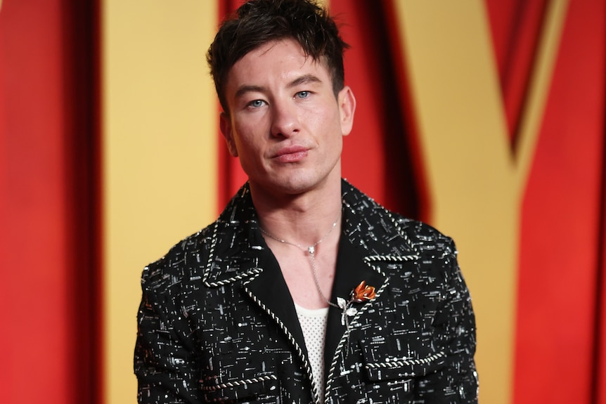 Barry Keoghan wears a black jackwt with stitch detailing.