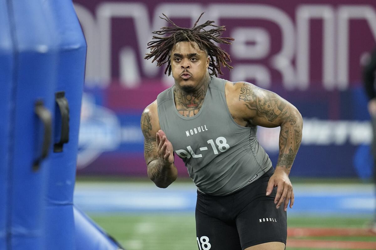 Texas defensive lineman Byron Murphy runs a drill at the NFL football scouting combine.