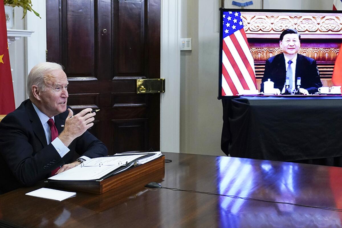 President Biden meets virtually with Chinese President Xi Jinping in 2021.