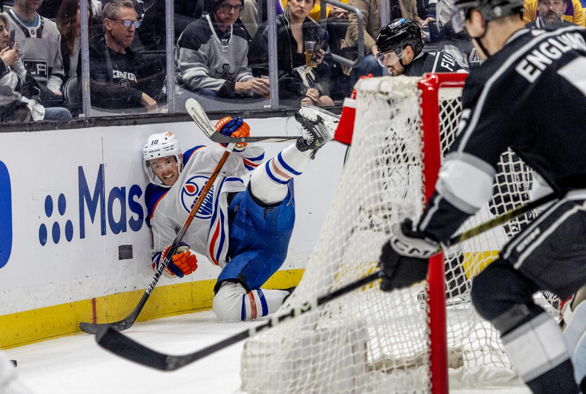 Edmonton Oilers forward Derek Ryan slams into the boards in front of Kings forward Kevin Fiala.