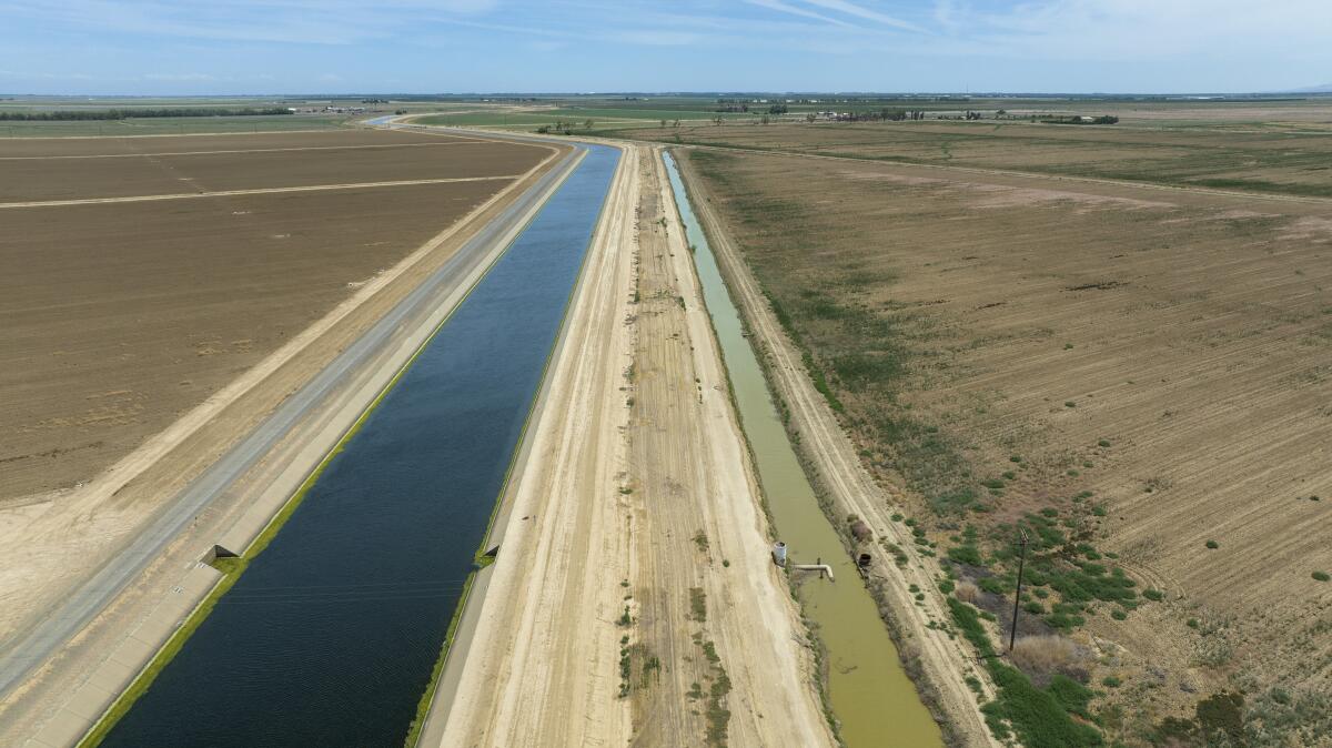 The Delta-Mendota Canal, left, ferries fresh water from Northern California to vast acres of farmland.