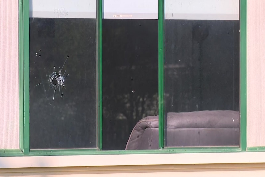 a window with a bullet shot after a tergeted shooting in blacktown