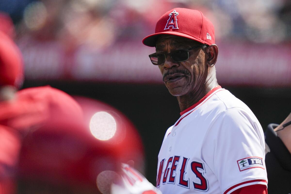Angels manager Ron Washington stands in the dugout during a baseball game against the Orioles.