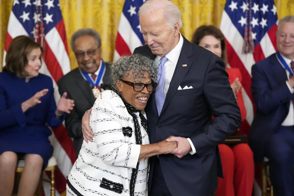 President Biden hugs Opal Lee during a ceremony in the East Room of the White House.