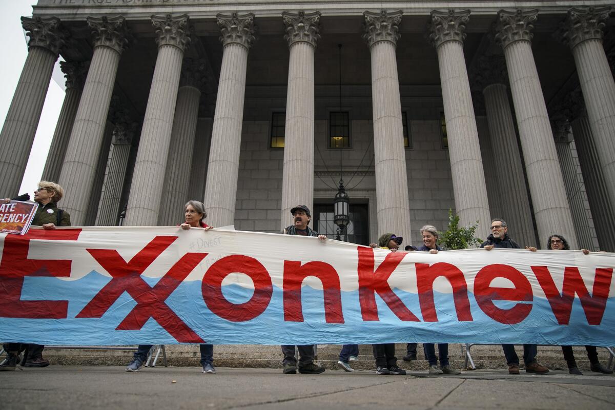 Activists rally for accountability for Exxon and other fossil fuel companies in New York City.