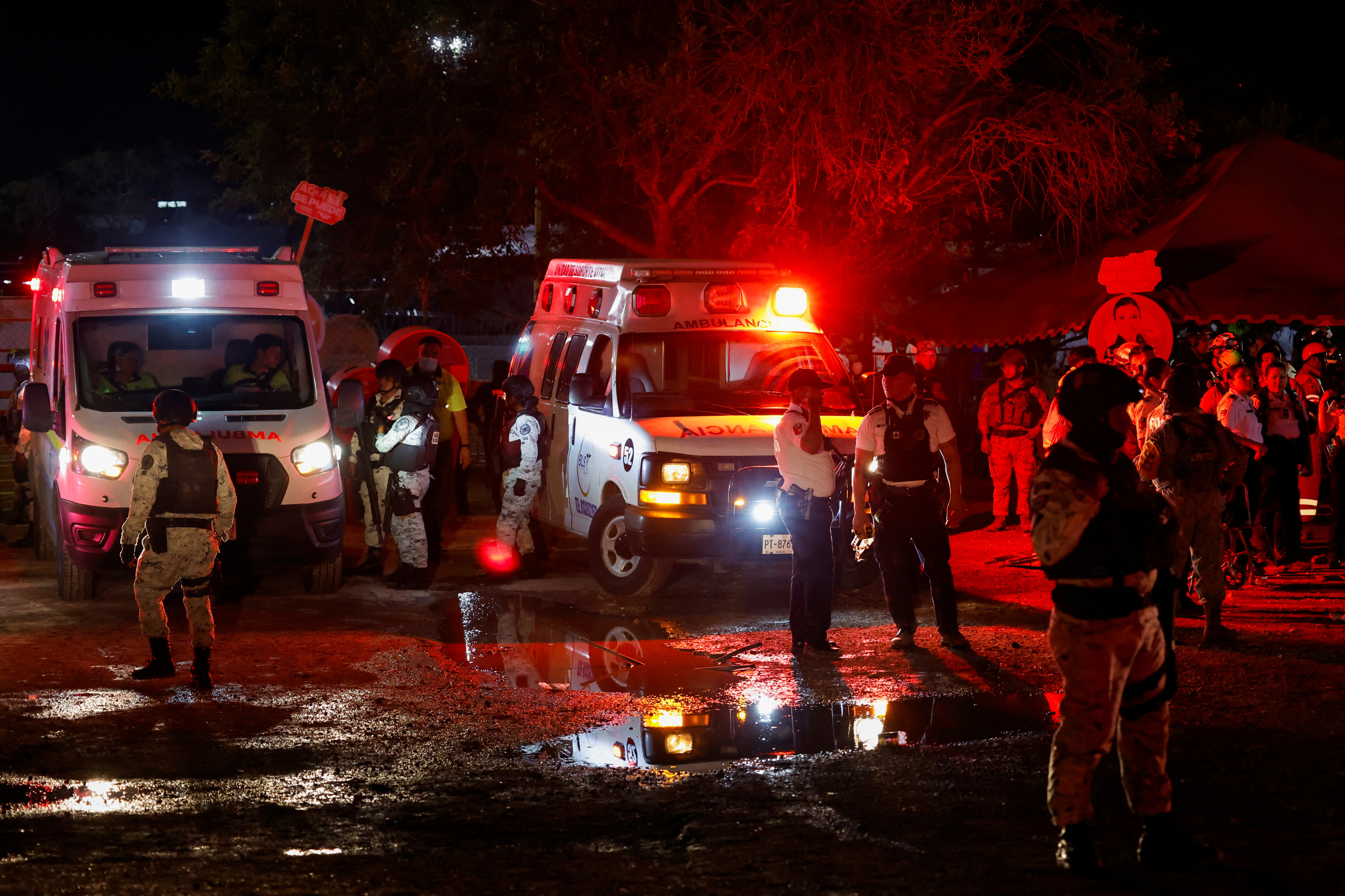 Emergency services and soldiers at the scene