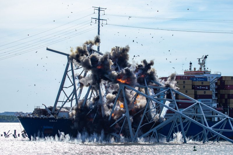 Salvors with the Unified Command perform a controlled demolition, precision cutting of section 4 of the Francis Scott Key Bridge that sits on the port side of the bow of the M/V DALI. The controlled demolition on Monday finally freed the container ship, which had been trapped in the wreckage since the fatal collision in March. Photo by Christopher Rosario/U.S. Army Corps of Engineers/UPI