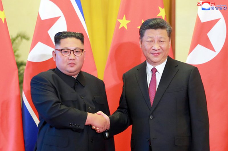 Chinese President Xi Jinping (R) sent a congratulatory message to North Korean leader Kim Jong Un (L) on the anniversary of the country's founding, state media reported Monday. The two have met several times, including in Beijing in 2018, but relations may be cooling between the longtime allies. File Photo by KCNA/UPI