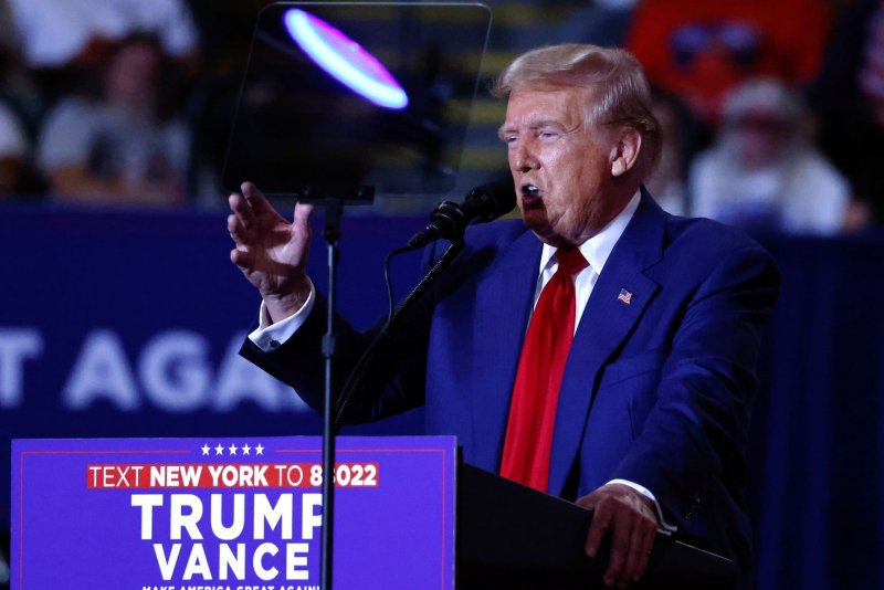 Former President Donald Trump speaks at a campaign rally Wednesday night at the Nassau Coliseum in Uniondale, New York where he accused Iran of foreign election interference. Earlier in the day, U.S. investigators confirmed Iran hackers had stolen sensitive documents from the Trump campaign this summer and emailed them to individuals associated with the Biden campaign. Photo by Peter Foley/UPI