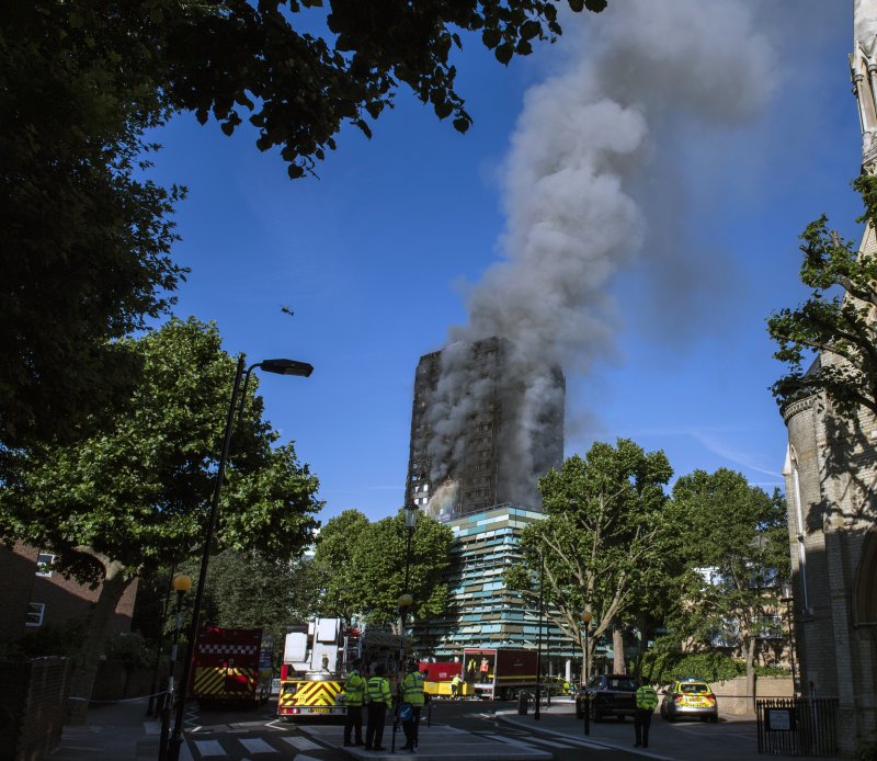 London firefighters the morning after Grenfell Tower, a 24-floor apartment block in north Kensington went up in flames in the early hours of June 14, 2017. File Photo by Will Oliver/EPA