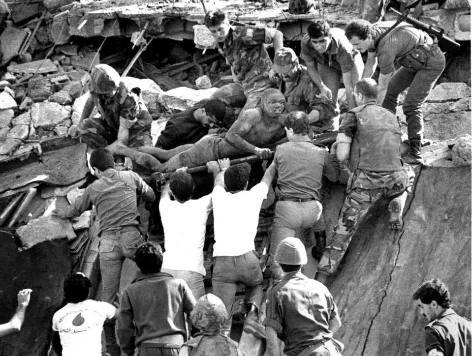 Soldiers help to rescue those trapped under debris at the US Embassy in Beirut