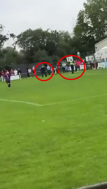 The 31-year-old footballer is escorted off the pitch by two cops
