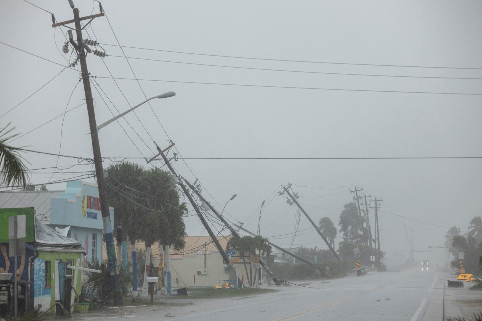 Broken utility poles downed by strong wind