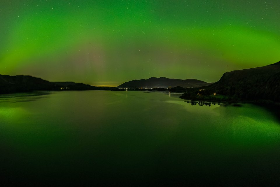 Aurora Borealis shines over Derwent Water near, Keswick, Lake District, Cumbria
