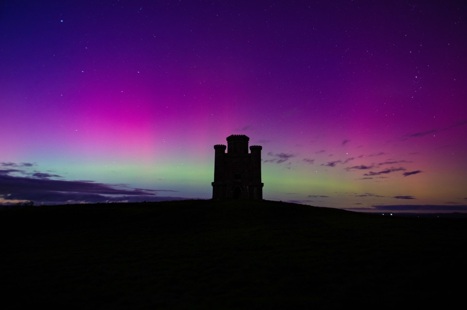 Northern lights appear behind Paxton's Tower in Llanarthne