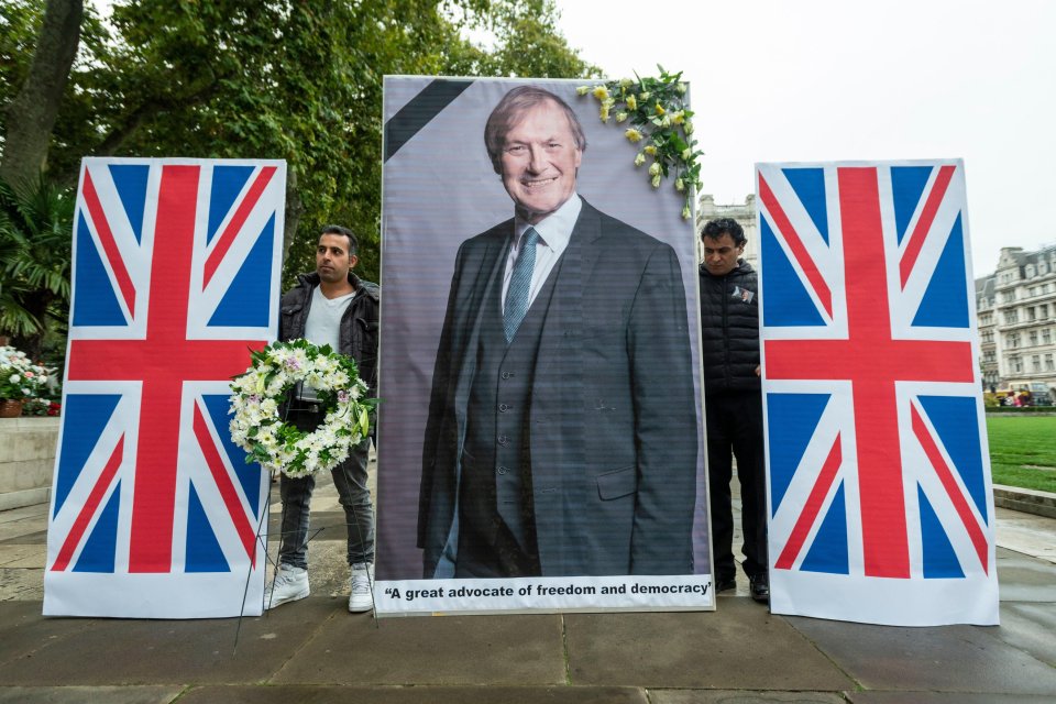 Members of the Anglo-Iranian community held a service in Parliament Square in tribute to Sir David