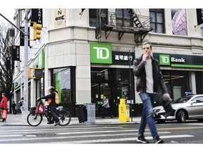 Pedestrians pass in front of a TD Ameritrade Holding Corp. bank branch in New York, New York, US., on Saturday, April 20, 2019. TD Ameritrade Holding Corp. is scheduled to release earnings figures on April 23.