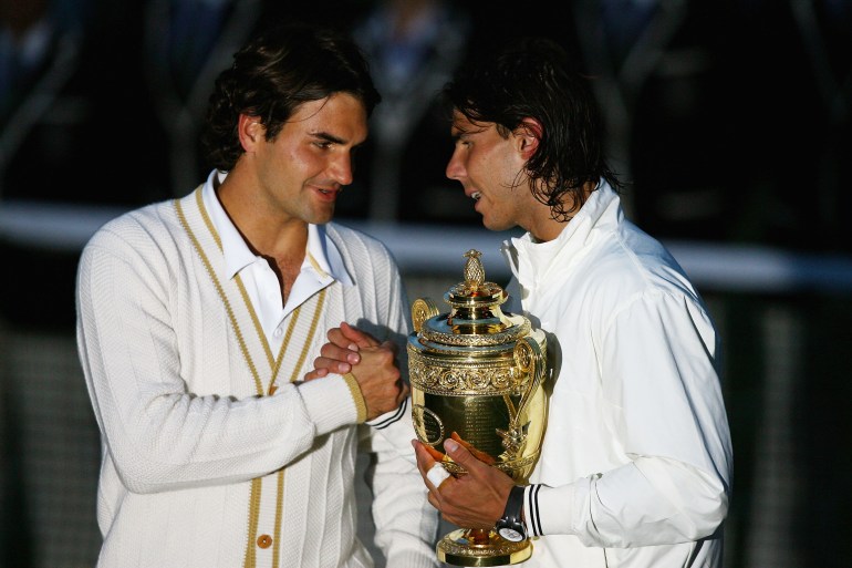 LONDON - JULY 06: Roger Federer of Switzerland congratulates Rafael Nadal of Spain in winning the Championship trophy during the men's singles Final on day thirteen of the Wimbledon Lawn Tennis Championships at the All England Lawn Tennis and Croquet Club on July 6, 2008 in London, England. (Photo by Julian Finney/Getty Images)