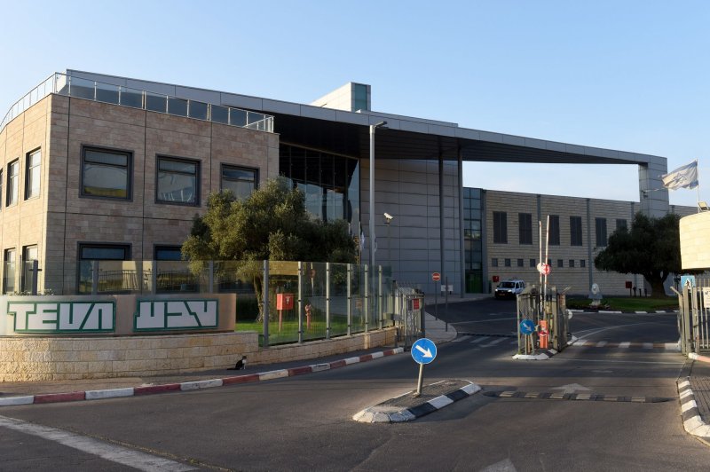 The Teva Pharmaceutical logo is seen in English and Hebrew at its tablet production plant in Jerusalem in 2019. The company agreed Thursday to pay $450 million to settle charges stemming from two kickback schemes. File Photo by Debbie Hill/UPI