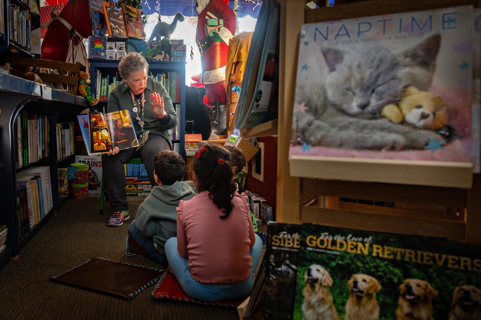 Maureen Palacios reads to children at Once Upon a Time bookstore in Montrose.