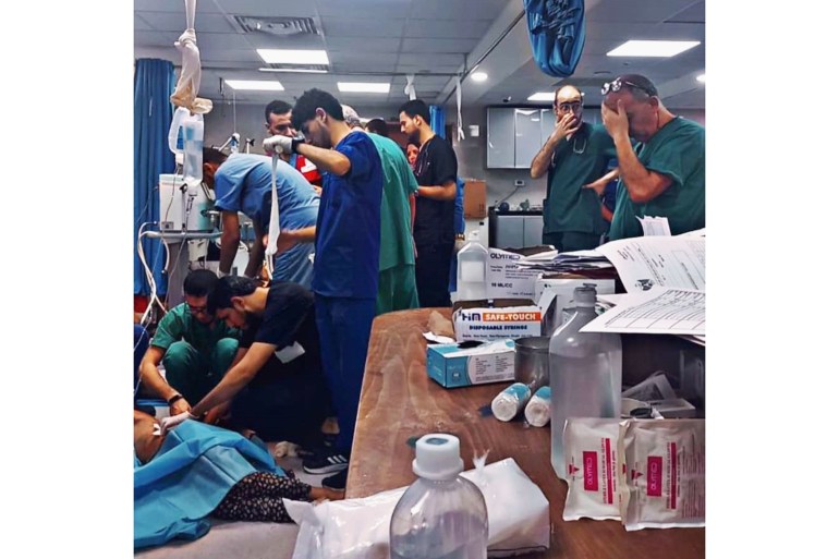 a photo of an emergency ward with nurses and doctors attending to the injured