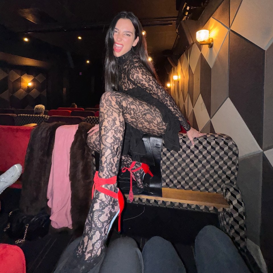 The Grammy winner frolicked atop a cinema's plush seats