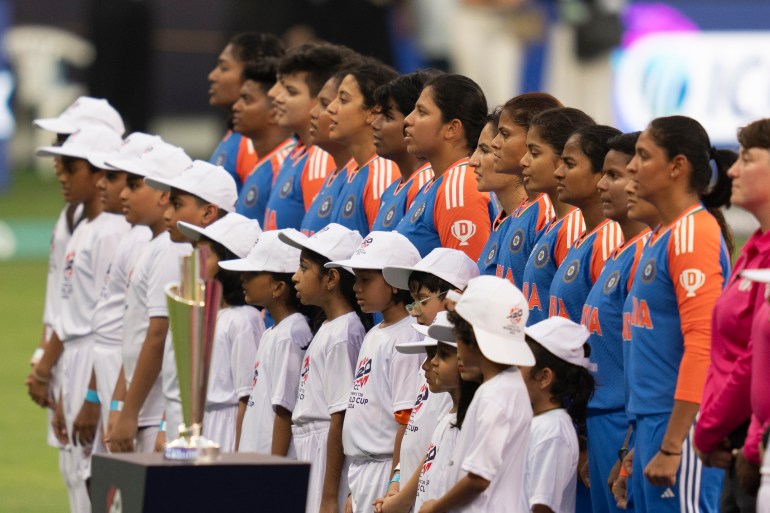 Indian players stand for their national anthem ahead of the ICC Women's T20 World Cup 2024 match between India and New Zealand at Dubai International Stadium, United Arab Emirates, Friday, Oct. 4, 2024. (AP Photo/Altaf Qadri)