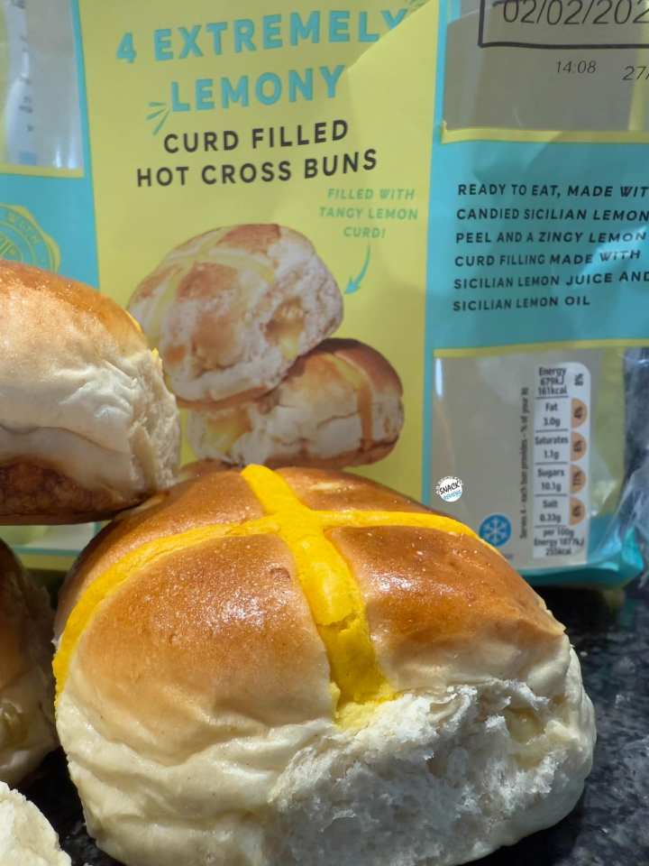 Four extremely lemony curd-filled hot cross buns.