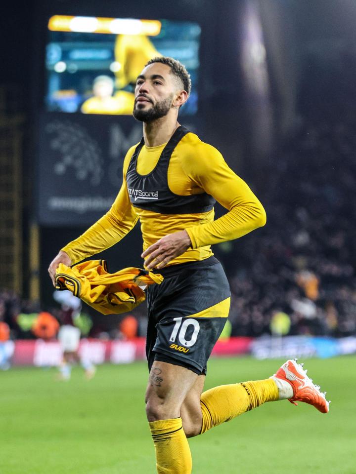 Matheus Cunha (#10, Wolves) celebrates scoring a goal.