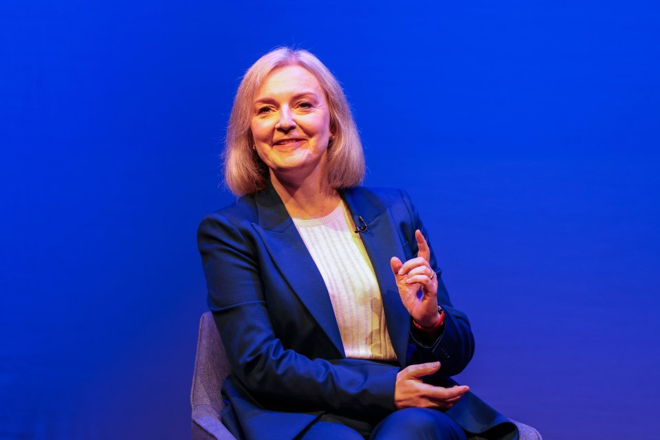 Liz Truss speaking at a Conservative Party conference.