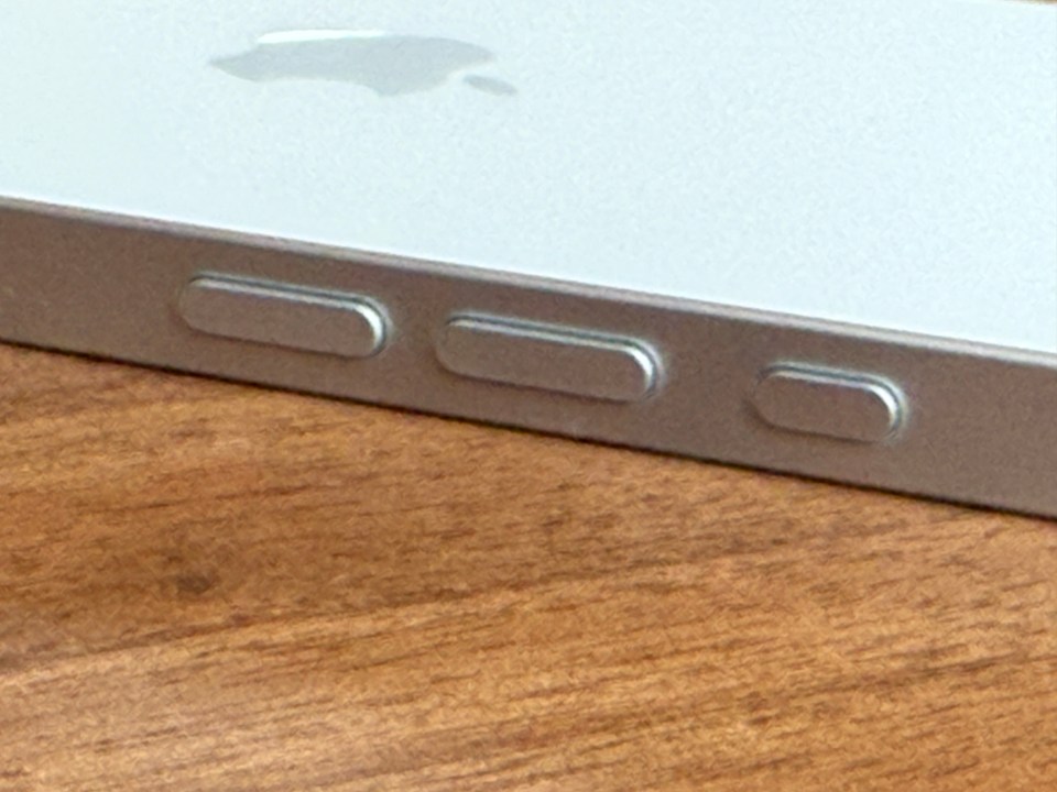 Close-up of iPhone's side buttons.