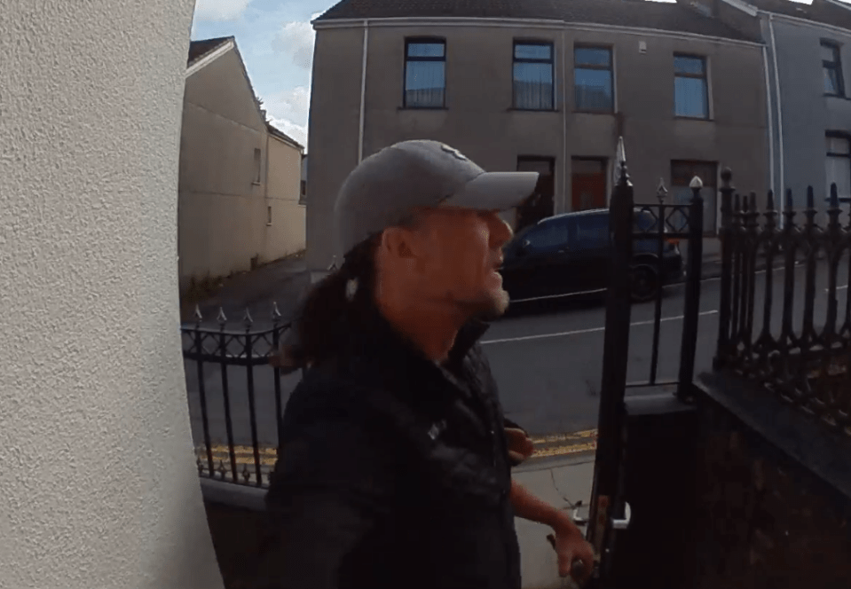 Man opening a gate.