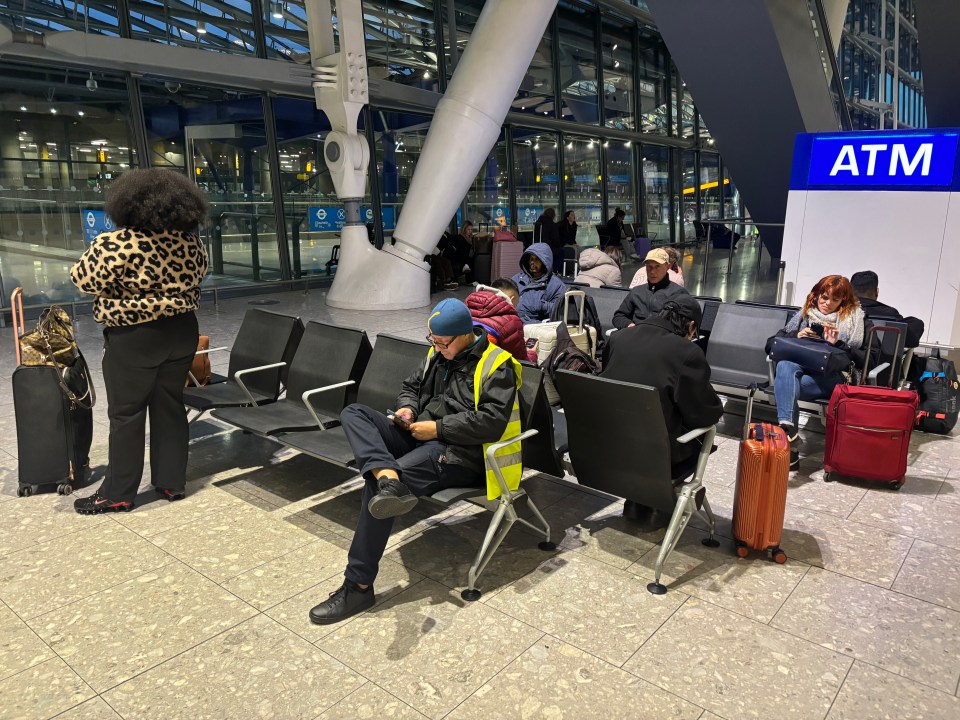 Passengers waiting in Heathrow Airport.