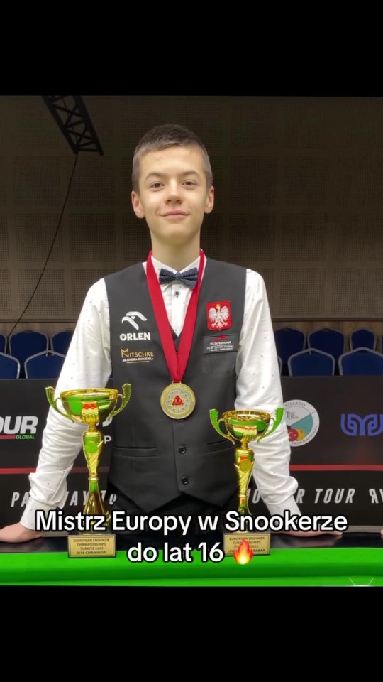 Teenage European snooker champion with trophies and medals.
