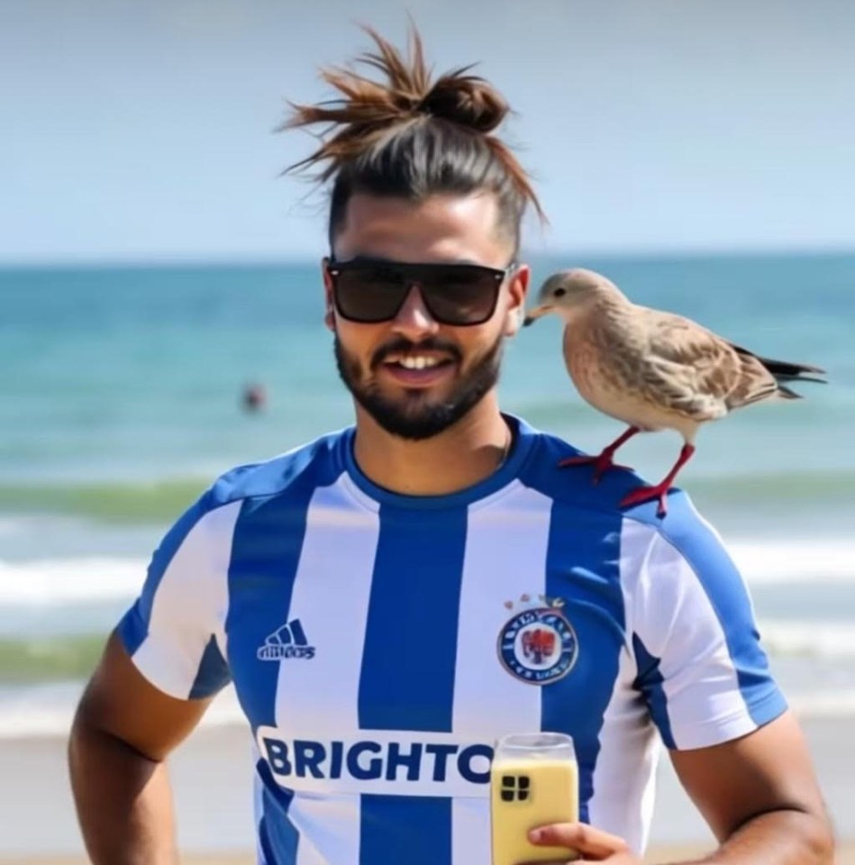 Man in Brighton football shirt with bird on shoulder, holding drink.