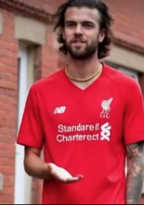 Man in Liverpool jersey.