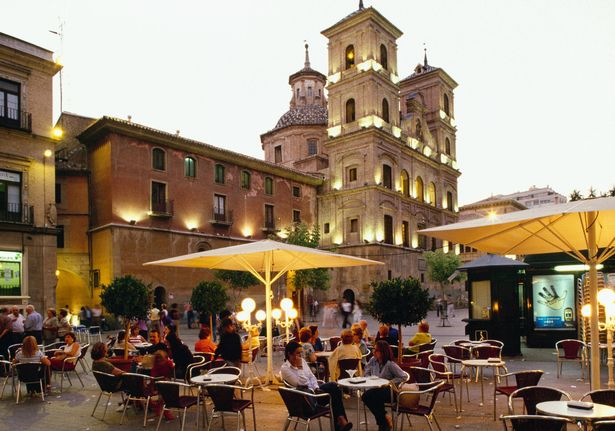 Cafe at Plaza de Santo Domingo with Iglesia de Santo Domingo in background. | Location: Murcia, Spain.