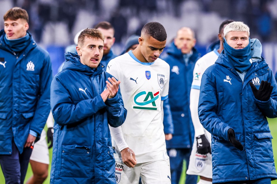 Dejected Marseille soccer players after a penalty shootout.