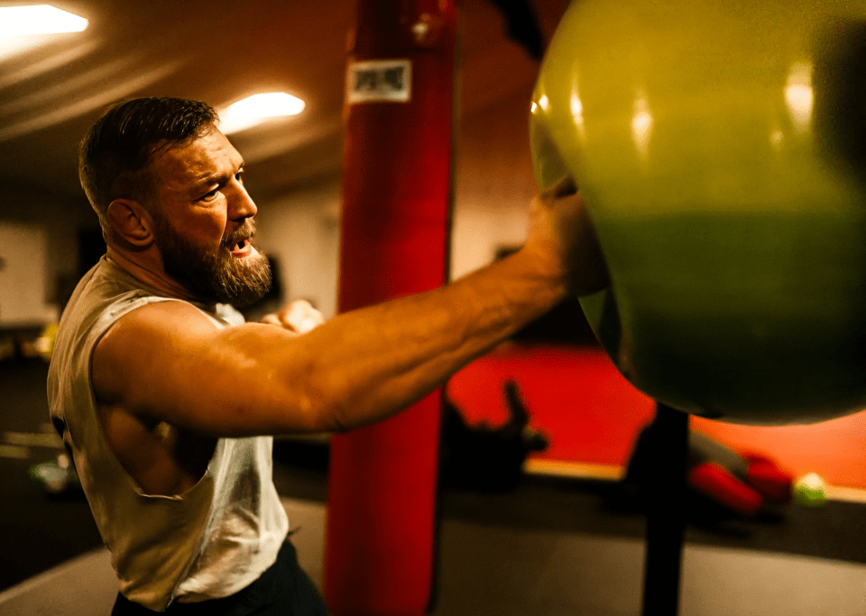 Man training with a large exercise ball.