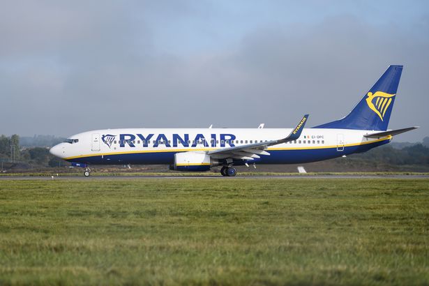 A Ryanair passenger plane taxis on the runway at Luton airport 
