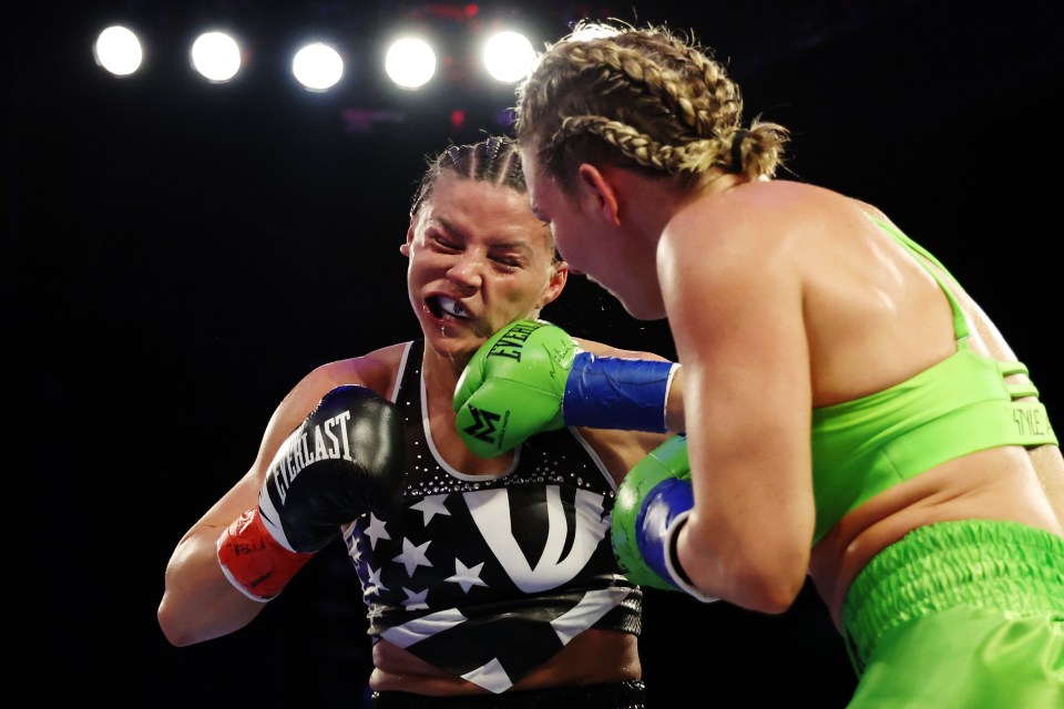 Mikaela Mayer (green trunks) boxing Sandy Ryan (black trunks) in a WBO Welterweight title bout.