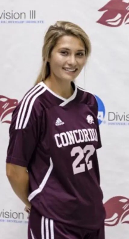 Portrait of a female Concord University soccer player wearing a maroon jersey with the number 22.