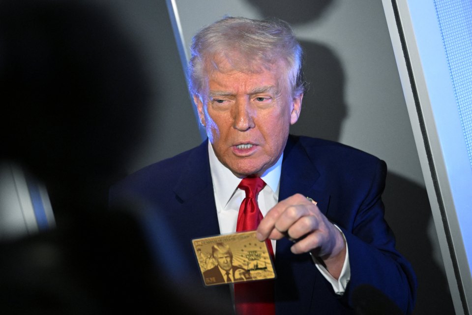 President Trump holding a card on Air Force One.