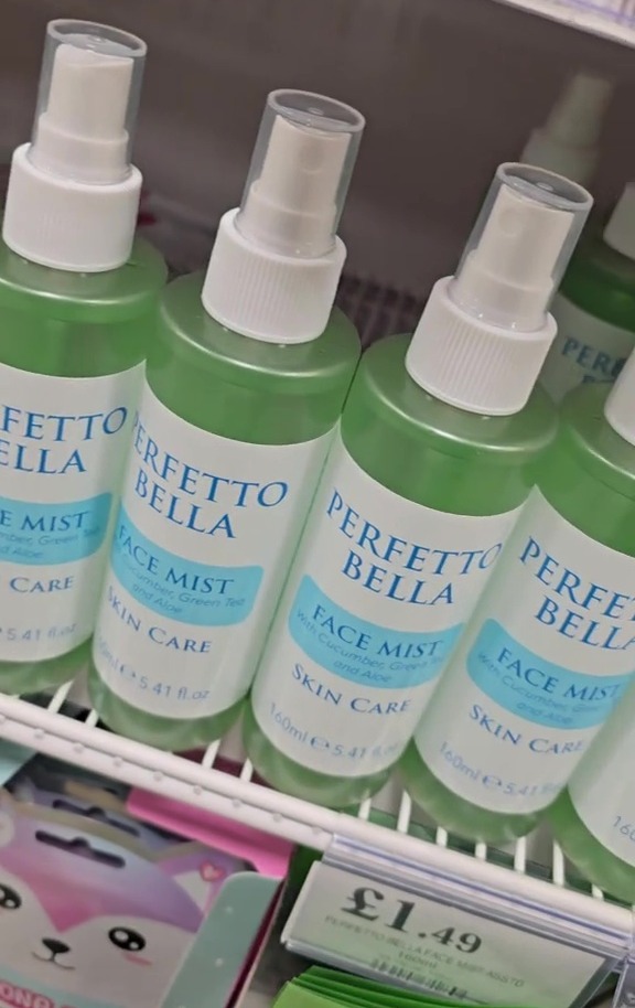 Several bottles of Perfetto Bella face mist on a store shelf.