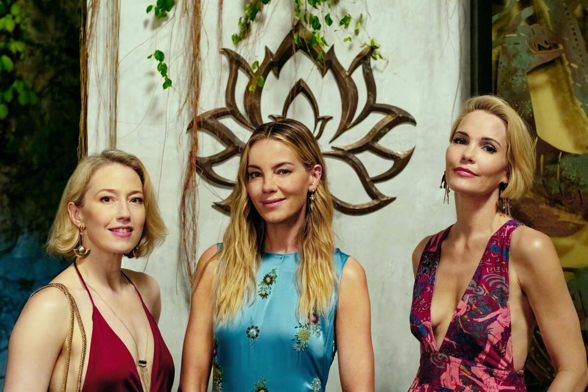 Three women in sleeveless dresses
